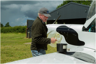 Vans RV-7 EI-HUM being topped up by Gerry Humphreys