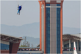 Parachutist comes into land with Kalma tower in the background